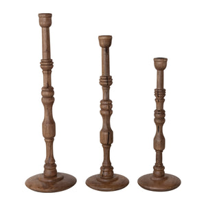 The CREATIVE COOP TURNED MANGO WOOD TAPER HOLDER, SMALL, features a traditional baluster-style stem and round base in mango wood, showcased on a white background.