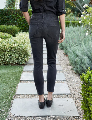 A pair of the FRANK & EILEEN Sligo Skinny Jeans in the 1991 Wash is laid flat against a plain white background. These jeans feature a high-rise contour waistband, five pockets, and a slightly faded design on the thighs, offering a stylish and modern look with Italian Performance Denim for added comfort.