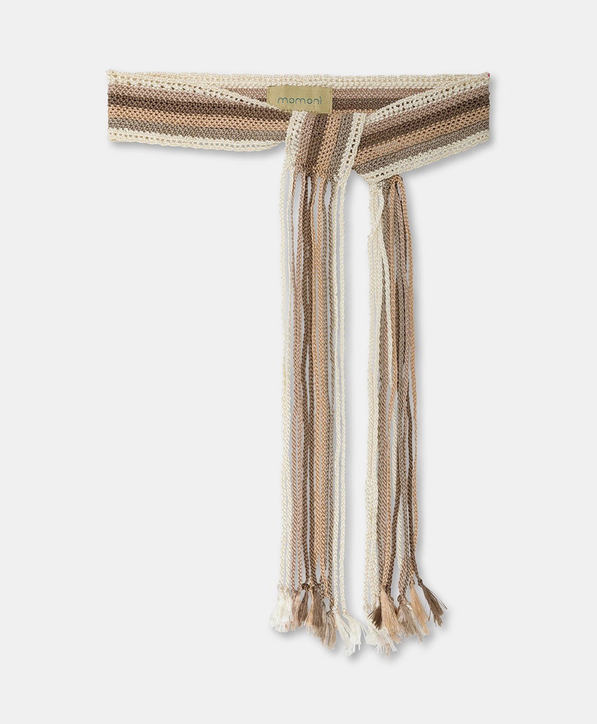 The MOMONI - JOSIE SASH BELT by MOMONI is a knitted accessory with braided maxi fringes in beige, cream, and brown shades. It features varying length fringes and a small label at the top.