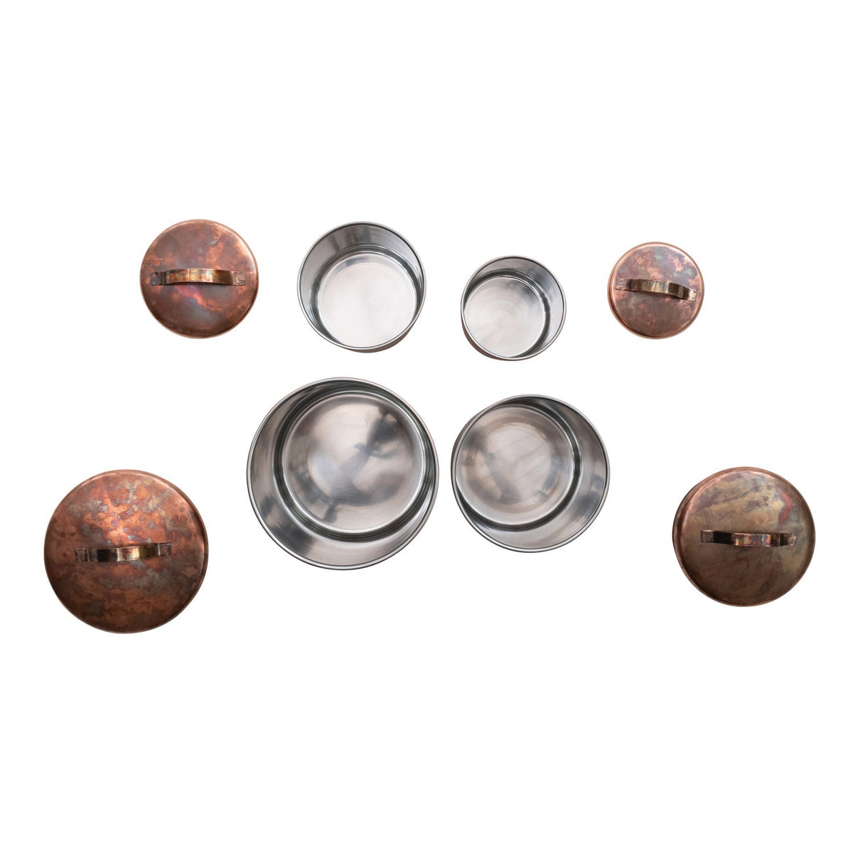 The CREATIVE COOP STAINLESS STEEL CANISTERS IN OXIDIZED COPPER FINISH, SET OF 4, feature simple metal handles and nest size by size—ideal farmhouse kitchen decor.