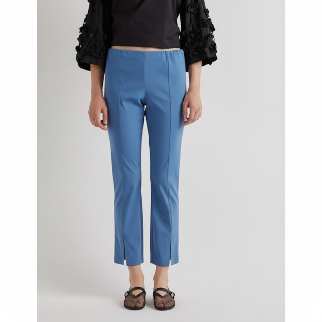 A solid bright blue background, echoing the vivid shade of the MEIMEIJ Front Hem Slit Pant in Jasper from MEIMEIJ, with no visible patterns, objects, or text.