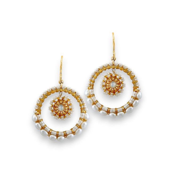 Discover the exquisite craftsmanship of the Miguel Ases Collection with these stunning Crystal Miyuki Drop Earrings by MIGUEL ASES, INC. Handcrafted in America, these decorative earrings feature intricate designs embellished with pearls, each showcasing an outer and inner circular motif adorned with small and large pearls. They dangle elegantly from golden hooks in a luxurious 14K gold-fill.