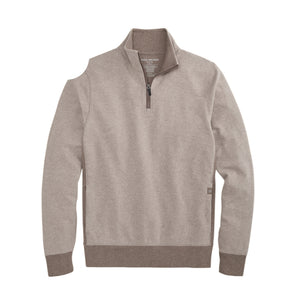 A man wearing a tan Mack Weldon ACE QUARTER ZIP French terry pullover with ribbed cuffs and hem.