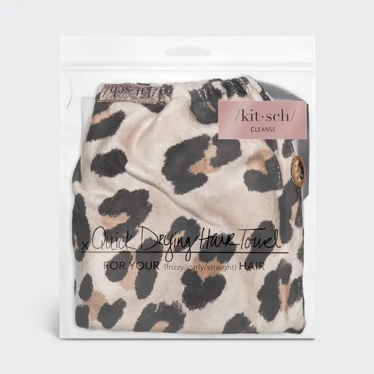 The KITSCH Quick Dry Hair Towel packaging highlights its luxurious eco-friendly blend of organic cotton and bamboo, showcasing softness and high absorbency. An image emphasizes friction-free drying, with the towel elegantly displayed beside the box, reflecting its natural allure.