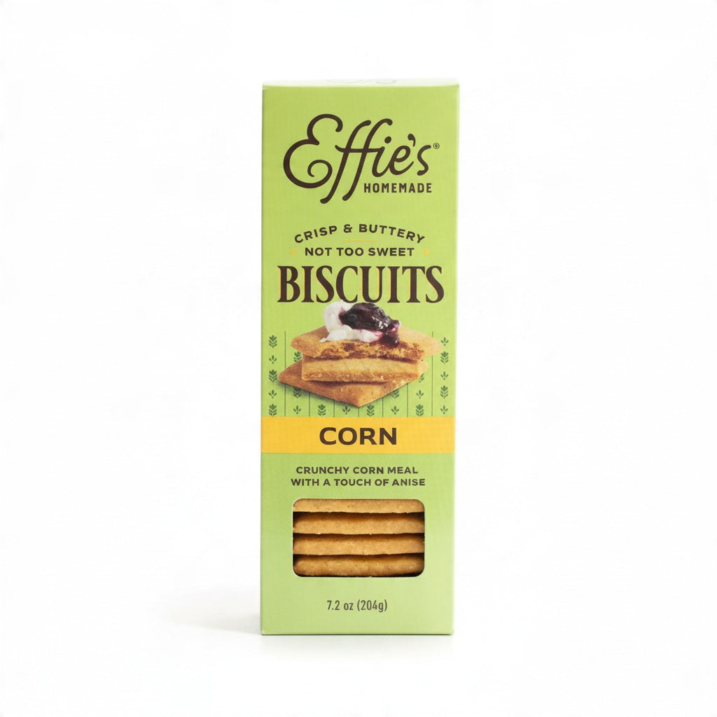 A vertical box of EFFIES - CORN BISCUIT with a clear window revealing the stack inside, featuring images of biscuits topped with jam and a label noting their crisp, buttery texture, subtle anise flavor, and that they are perfect with coffee.