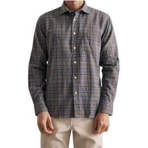 A close-up of the HARTFORD - PAUL Checked Flannel Shirt in Grey highlights the blue, brown, and grey plaid cotton fabric, with a focus on the cuff and sleeve featuring visible white buttons.