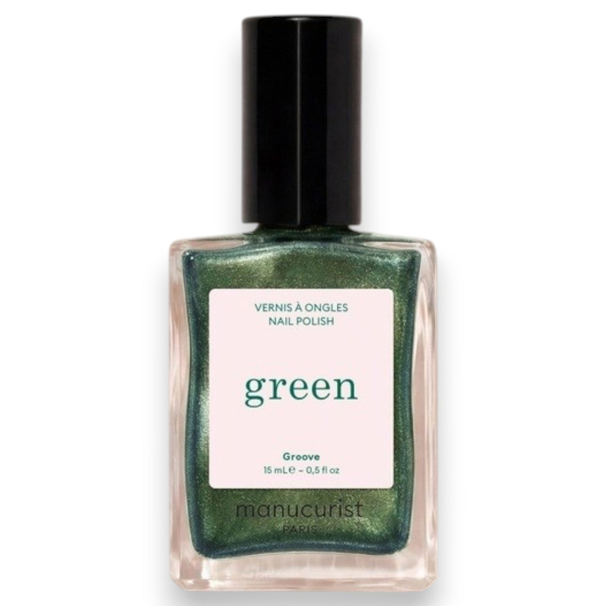 A hand with metallic green nails holds a bottle of MANUCURIST - GREEN™ NAIL POLISH IN GROOVE from MANUCURIST INC, perfectly matching the light green shirt in the background.