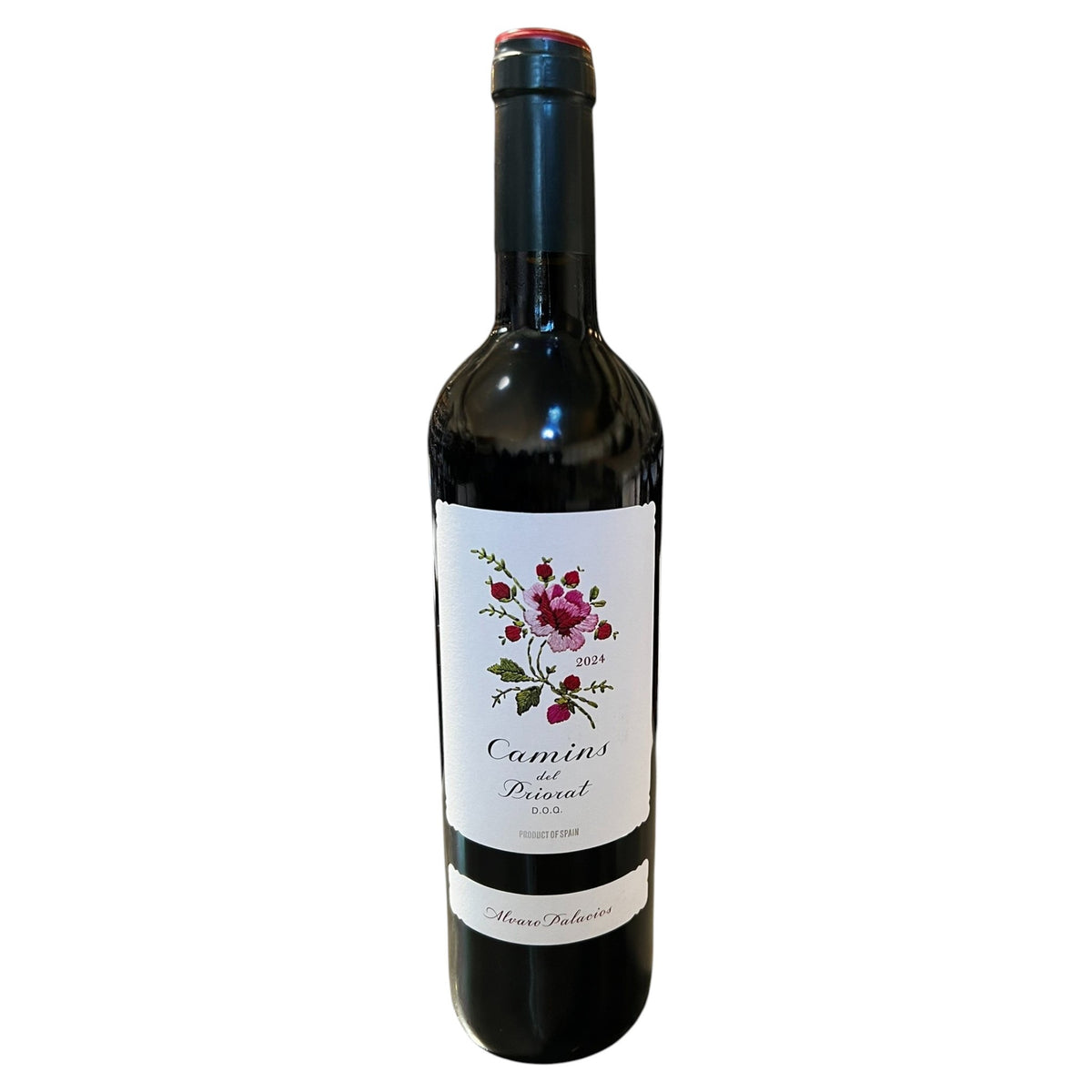 A bottle of ALVARO PALACIOS ‘CAMINS DEL PRIORAT’ 2024 red wine from WINE: ADVINTAGE, featuring a white label adorned with a floral illustration and the text “Camins del Priorat 2024” and “Product of Spain.” Crafted by acclaimed winemaker Álvaro Palacios, this Garnacha blend is elegantly finished with a dark foil around the neck.