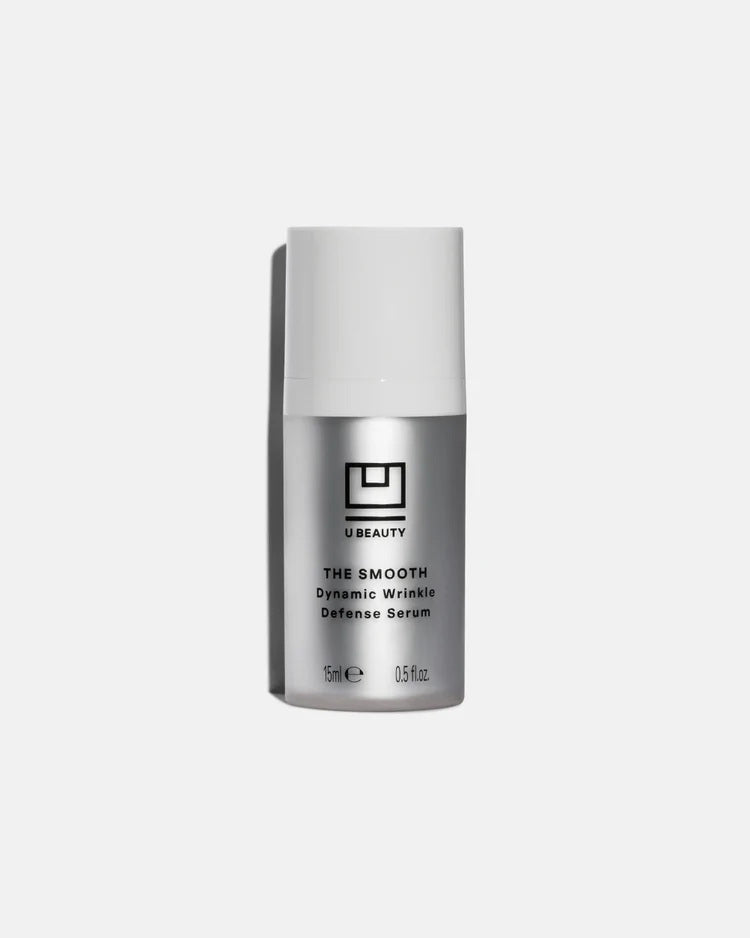 A silver and white bottle of U BEAUTY's THE SMOOTH DYNAMIC WRINKLE DEFENSE SERUM 15ML stands upright on a plain light gray background.