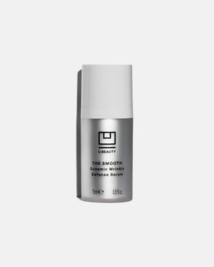 A silver and white bottle of U BEAUTY's THE SMOOTH DYNAMIC WRINKLE DEFENSE SERUM 15ML stands upright on a plain light gray background.