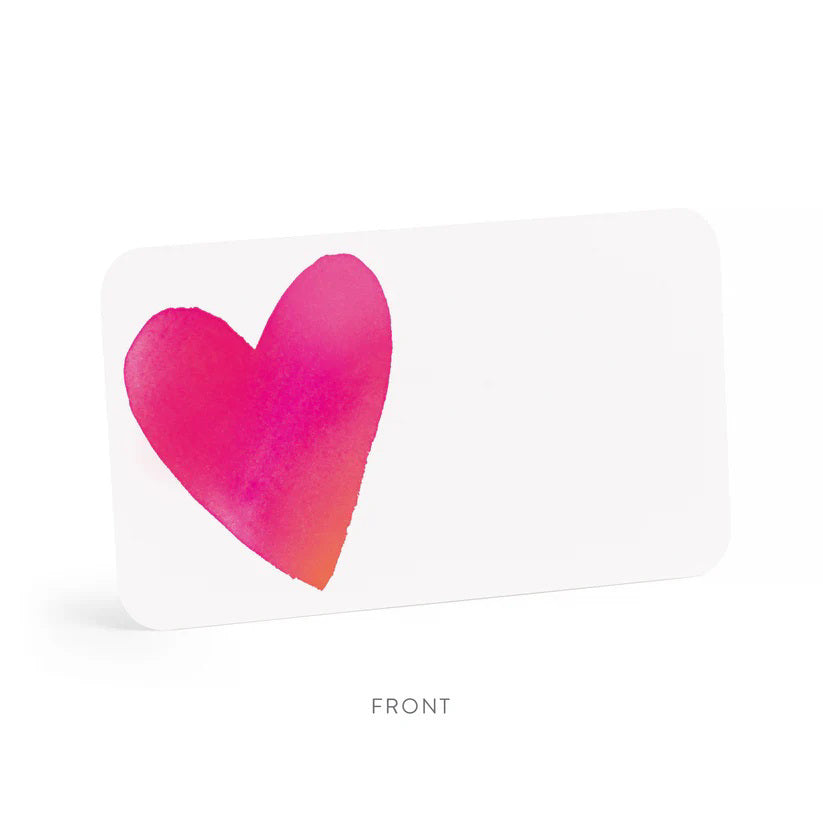 A clear box contains 85 tiny notecards each featuring a pink heart, labeled &quot;E. FRANCES PAPER - BIG HEART LITTLE NOTES.&quot; With the tagline &quot;use unsparingly,&quot; this minimalistic packaging enhances its unique charm.