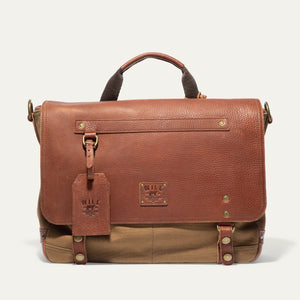 The WILL LEATHER GOODS Wallace Messenger Bag in Tobacco/Cognac features handcrafted leather and canvas, a top handle, front flap, brass hardware, stitched detailing, and a branded leather tag for timeless style.