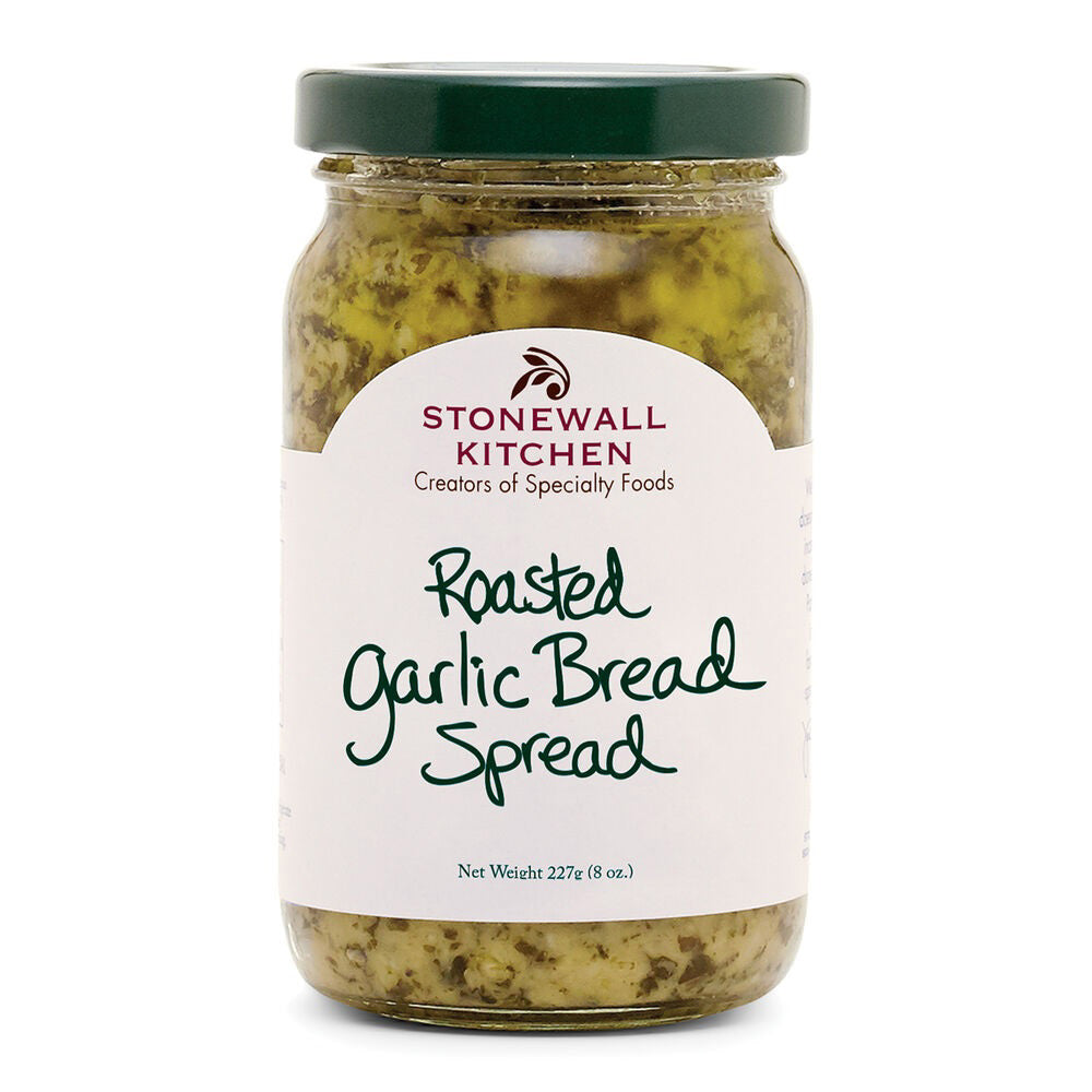 A jar of STONEWALL KITCHEN - ROASTED GARLIC BREAD SPREAD with a green lid. The label features the Stonewall Kitchen logo along with the words "Creators of Specialty Foods" and "Roasted Garlic Bread Spread with Parmesan Cheese." The jar holds 227 grams (8 oz) of delicious garlic bread spread.