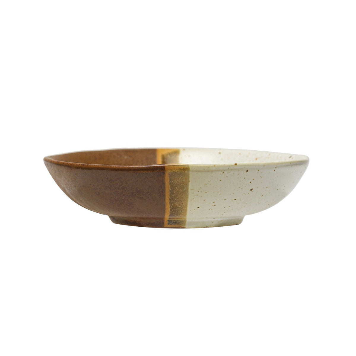 The STONEWARE LOW BOWL IN EARTH TONE REACTIVE GLAZE by CREATIVE COOP features a speckled off-white top, solid brown bottom, and an olive-brown stripe, highlighting handcrafted artistry with a beautiful reactive glaze finish.