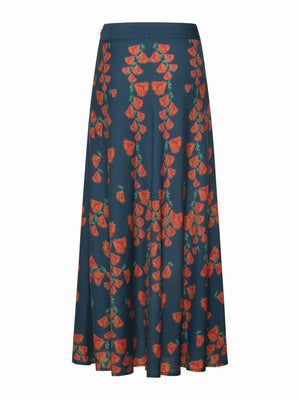 The FRANCO FERRARI JEMMA Wool Midi Skirt is a long, dark blue A-line skirt with red and orange floral prints and green stems, shown on a plain white background.