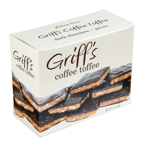 A box of Griff's Toffee - Coffee 7oz by GRIFFS TOFFEE, offering a gluten-free delight with rich dark chocolate and pecan flavors. The front displays an image of the toffee pieces stacked to reveal layers of chocolate, coffee, and pecans. The box weighs 7 oz (198g).