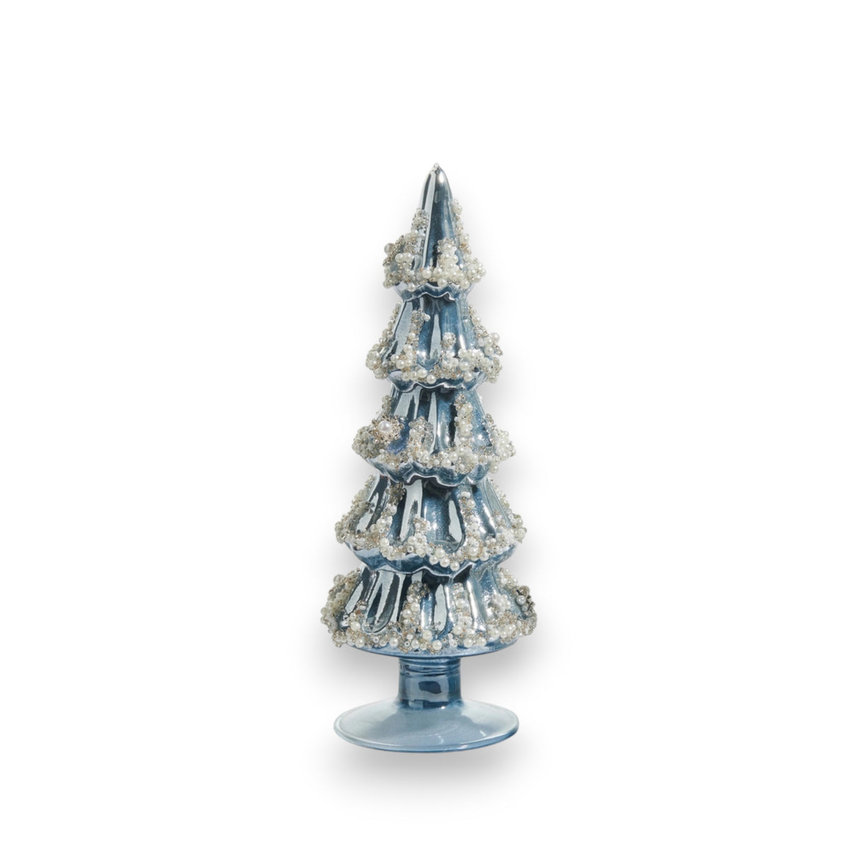 The EMBELLISHED PEARLIZED BLUE AND SILVER GLASS TREE by RAZ IMPORTS, featuring blue and silver accents, stands on a small round base beside a glass vase, all set against a white background.