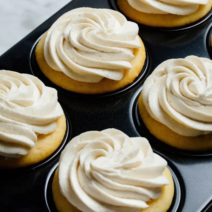 A green and brown package of CUP4CUP GLUTEN FREE YELLOW CAKE MIX by CUP4CUP, labeled "Gluten Free," features an illustration of a yellow layer cake with white frosting and a slice cut out. Perfect for premium baking.