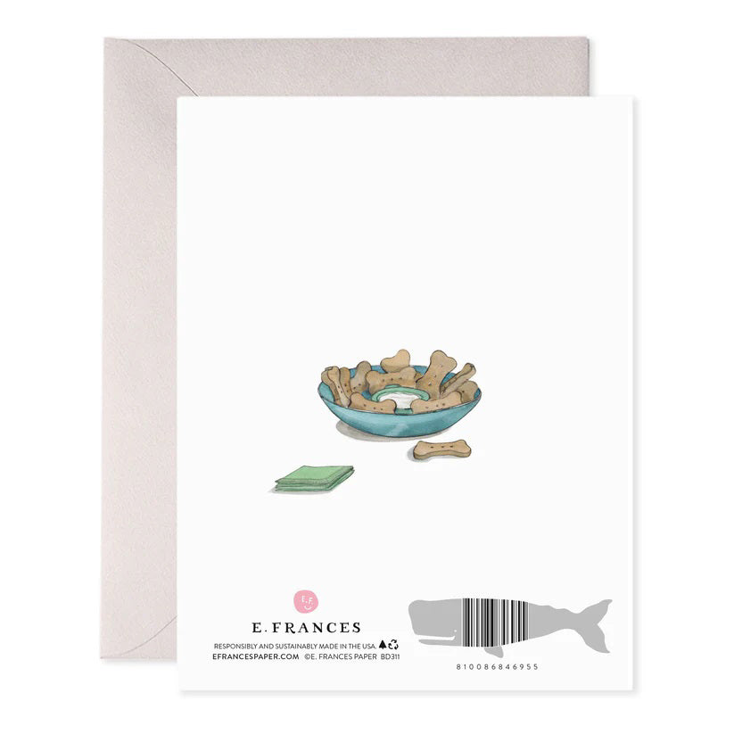 The E. FRANCES PAPER Dog Party Birthday Card is handcrafted with anthropomorphic dogs in party hats, featuring one with a cake and another with a gift. "Happy Birthday!" is highlighted in foil accents above them, while "Let's Party" appears below amidst balloons.