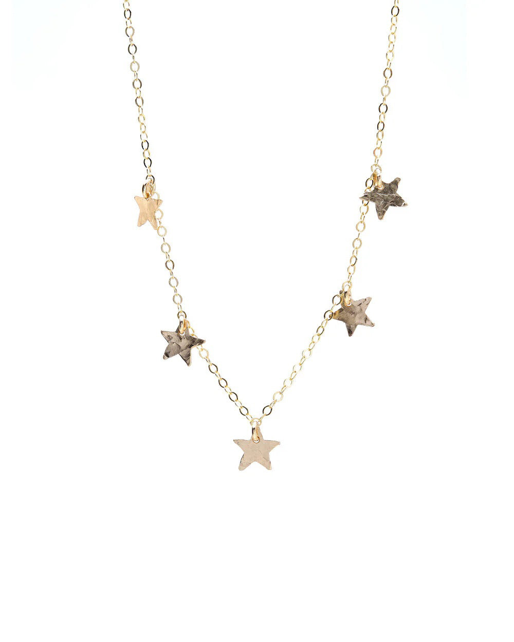 The KENDA KIST - THE 5 STAR CHOCKER NECKLACE is a delicate 14k gold filled choker featuring dainty stars along an elegant chain, designed by KENDA KIST.