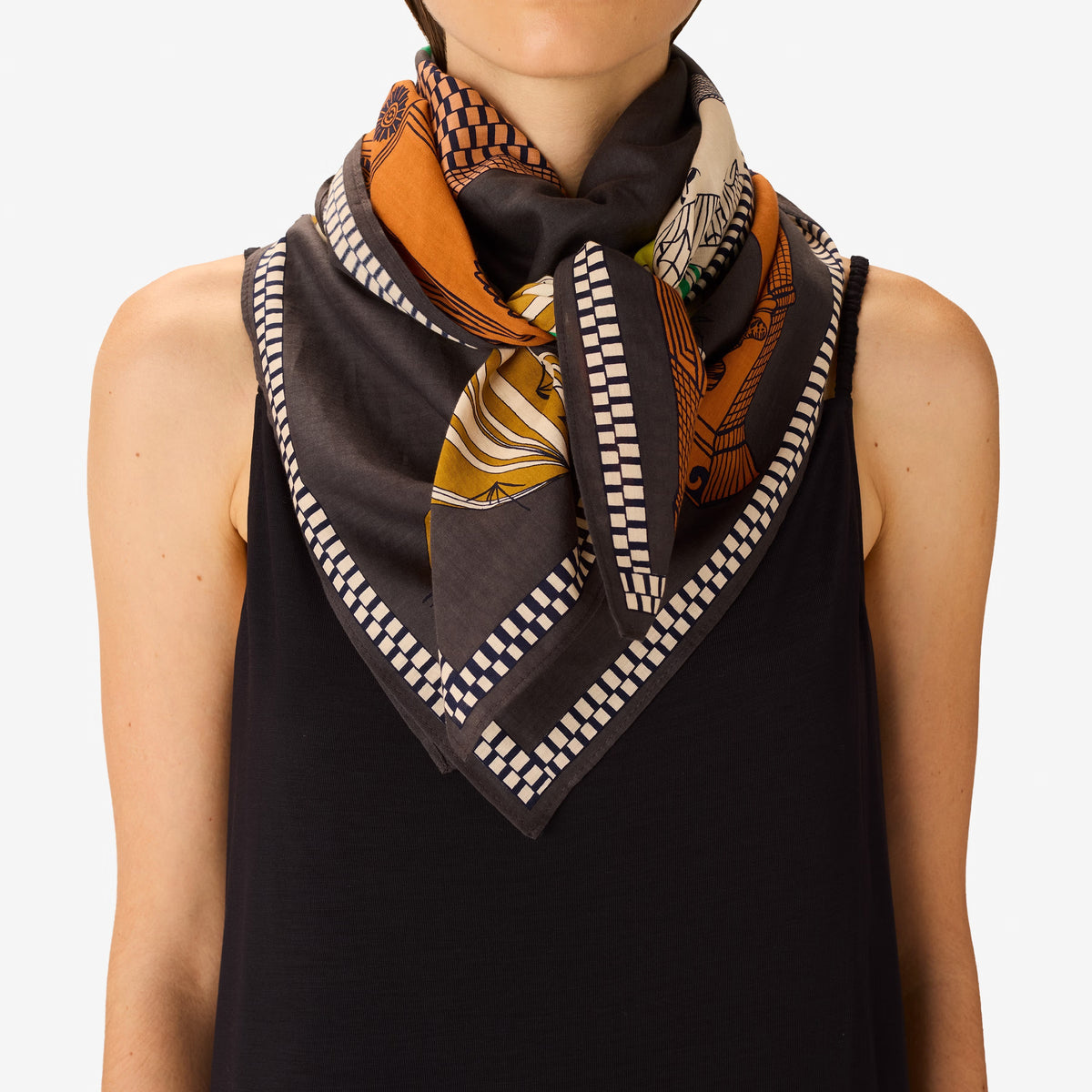 The INOUI EDITIONS - TEQUILA SCARF IN LEMON by INOUI features vibrant cacti and succulents in green, yellow, and white on brown and gray pedestals, set against a dark gray background with a decorative border.