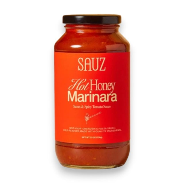 A glass jar of SAUZ - HOT HONEY MARINARA sauce with a red label featuring white text and a honey dipper illustration.