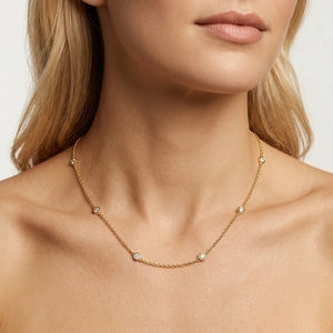 The ELLA STEIN - IN THE LOOP NECKLACE (16″) by ELLA STEIN is a delicate gold chain necklace featuring evenly spaced small round natural diamonds set in bezels along the chain.