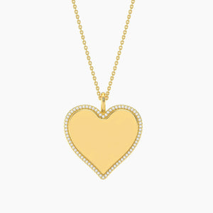 The ELLA STEIN - FOREVER LOVE PENDANT NECKLACE by ELLA STEIN features a fine gold-plated chain with an adjustable clasp and a heart-shaped pendant with a smooth, shiny finish. The product is displayed against a plain white background.