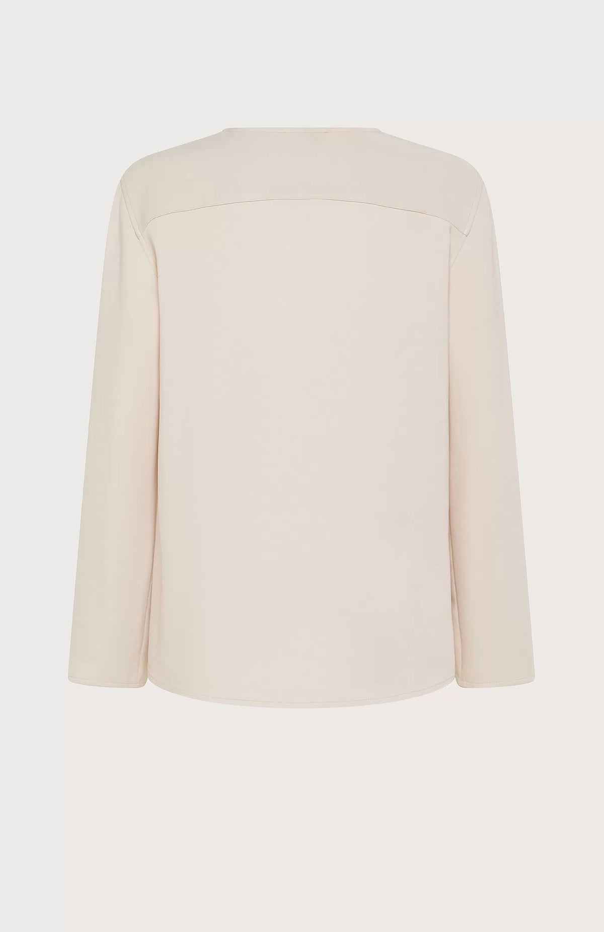 The SEVENTY Stretch Crewneck Viscose Top with Sleeve Detail is a light beige, long-sleeve shirt featuring a simple and elegant design. Made in Italy, this sophisticated top has slightly flared sleeves with subtle slits near the cuffs and a relaxed fit. Crafted from stretch viscose cady, it hangs straight for a minimalistic and refined appearance.