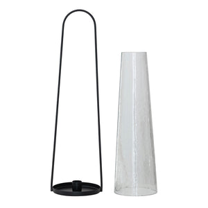 The CREATIVE COOP ROUND METAL LANTERN TAPER HOLDER features a tall, hammered glass hurricane in a minimalist black metal frame with a rounded handle—ideal as a lantern holder for modern spaces.