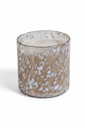 ZODAX TONKA ABSOLUTE SPECKLED LUMIN CANDLE, a three-wick scented candle in a cylindrical glass jar with a brown and white speckled pattern.