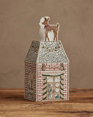 HOME FOR THE HOLIDAYS TISSUE BOX COVER shaped like a house, featuring an embroidered Christmas tree, string lights, and a teddy bear in a Santa hat for festive holiday home decor.