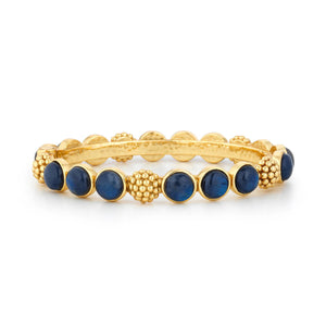 The CAPUCINE DE WULF Berry Gem Hinged Bracelet Labradorite features alternating round blue labradorite stones and textured 18K gold bead clusters, beautifully showcased on a white background.