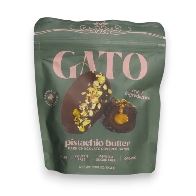 A green bag of GATO DATES - CHOCOLATE COVERED PISTACHIO BUTTER DATES by GATO DATES, featuring premium Medjool dates filled with creamy pistachio butter and real pistachio pieces. This Dubai chocolate treat is made with vegan chocolate and is proudly vegan, gluten free, sugar free, and organic.