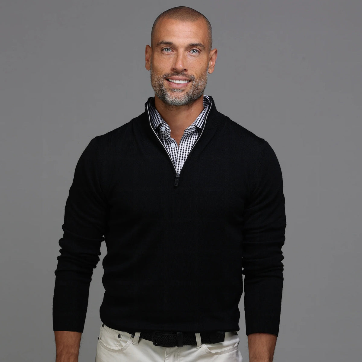 The COLLARS AND CO - CASHMERE TOUCH AUSTRALIAN MERINO 1/4 ZIP SWEATER by COLLARS AND CO is a black long-sleeve quarter zip sweater featuring a stand-up collar, crafted from Cashmere Touch Australian Merino wool and shown on a plain white background.
