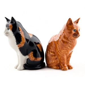 The QUAIL CERAMICS - ELEANOR & VINCENT CAT SALT & PEPPER SHAKERS by QUAIL DESIGNS feature an orange tabby and a black, white, and orange cat—ideal for any cat lover or to add charm to your kitchen decor.