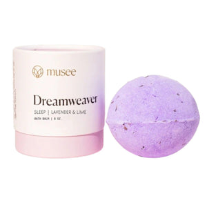 Instructional graphic with text on how to use the MUSEE - DREAMWEAVER THERAPY BATH BALM by MUSEE, featuring a dissolving colorful bath balm in pink bubbly water within a white flower outline on a pink background.