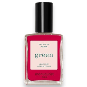 A bottle of MANUCURIST INC’s GREEN™ Nail Polish in the shade Peony, featuring a black cap and pink color visible through the clear glass.