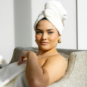 A packaged VOLO BEAUTY HAIR HERO TOWEL with soft Nanoweave fabric is in a clear bag, showing two Best of Beauty awards on the top right, set against a beige background.