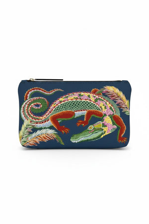 Introducing the INOUI EDITIONS - CROCO SMALL COSMETIC POUCH by INOUI, a navy blue zippered nylon pouch adorned with a colorful, embroidered alligator motif framed by decorative pink, brown, and green leaves. Made in India, this stylish accessory seamlessly blends functionality with vibrant design.