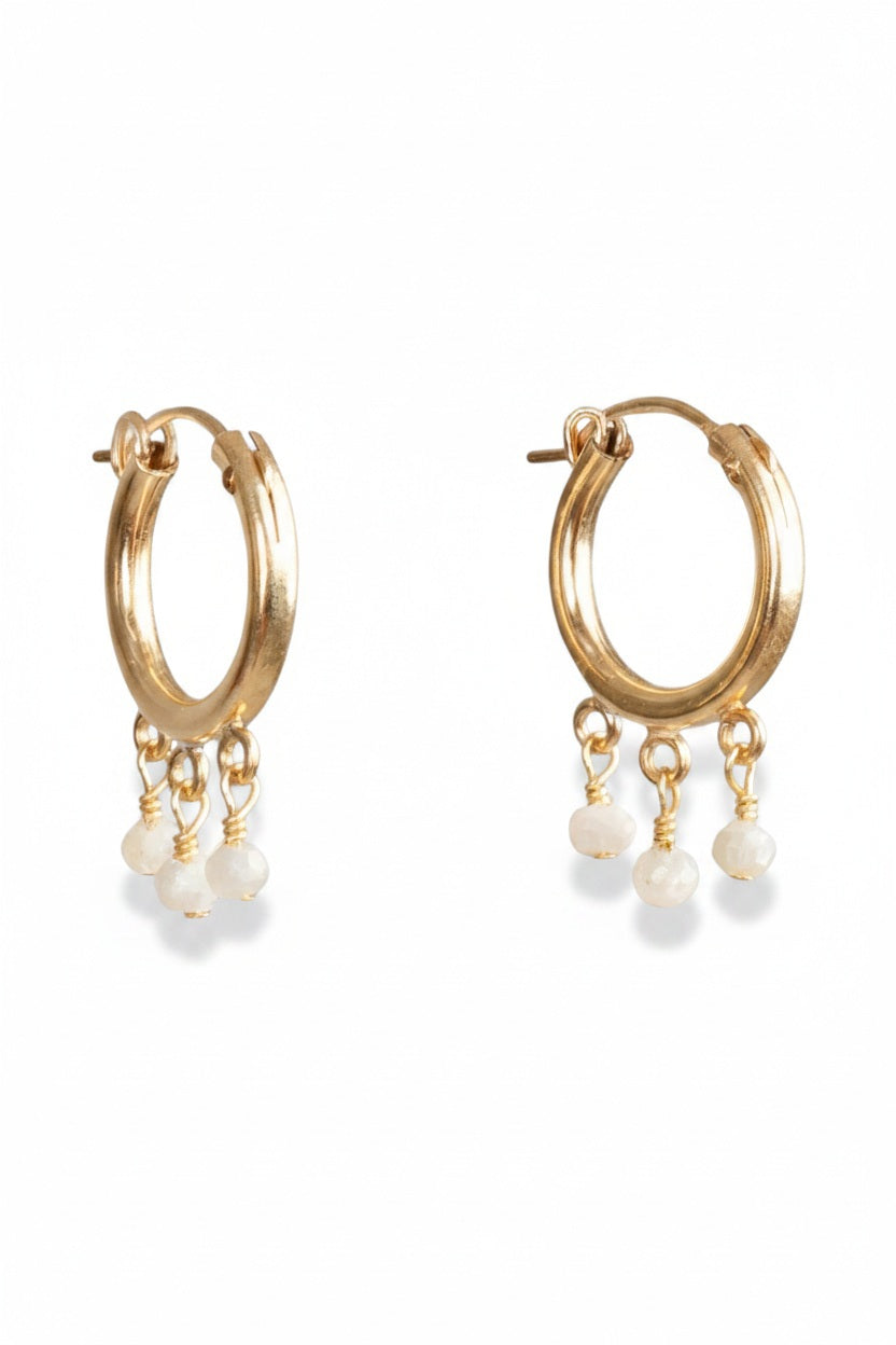 GOLDISH - FRINGE HOOP EARRINGS WITH WHITE PEARLS by GOLDISH: small gold fill hoops featuring three dangling white pearl charms, shown on a plain white background.