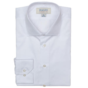 The HAGEN - COTTON DRESS SHIRT IN WHITE features premium cotton, a modern spread collar, and buttoned cuffs. The shirt displays the "HAGEN" brand label and is shown neatly folded against a plain white background.