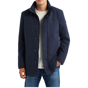 A man wears a dark blue SAVE THE DUCK - BLAISE JACKET IN BLUE BLACK with a high neck and a zippered chest pocket.