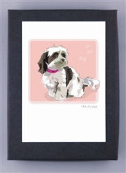 PAPER RUSSELLS - HAVANESE BOXED CARDS feature a small, fluffy white and brown dog with a pink collar on a pink background, framed in black. Printed on recycled paper and proudly made in the USA by PAPER RUSSELLS.