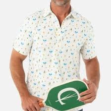 A man wears the CRIQUET Performance Sport Range Polo in white with a blue and yellow pickleballer print, standing against a plain background. This breathable men's polo is perfect for golf or any occasion.