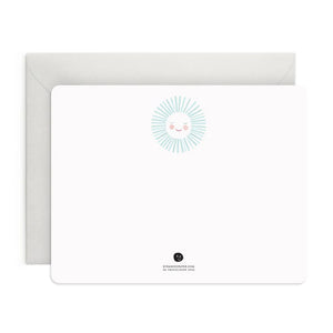 The E. FRANCES - FLAT NOTES BLUE SUNSHINE by E. FRANCES PAPER features a blank notecard with rounded corners and a cheerful sun at the top, paired with a plain white envelope—perfect illustrated stationery for hand-written notes on any occasion.