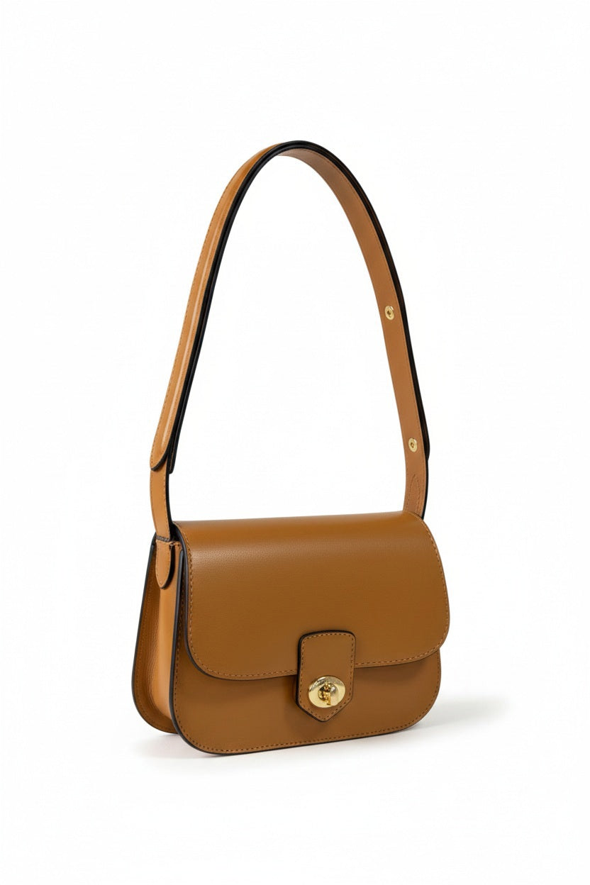 LE BORSETTE LEATHER HANDBAG IN COGNAC featuring a structured silhouette, gold-tone turn-lock closure, and an adjustable strap.