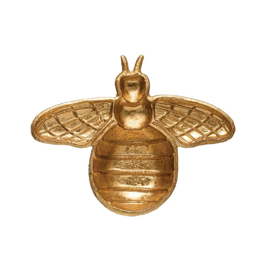 The CAST IRON BEE SHAPED DISH by CREATIVE COOP features a gold bee ornament with detailed wings and a rounded body, set against a white background. The simple yet elegant design captures the bee in a symmetric, frontal view, reminiscent of decorative elegance.