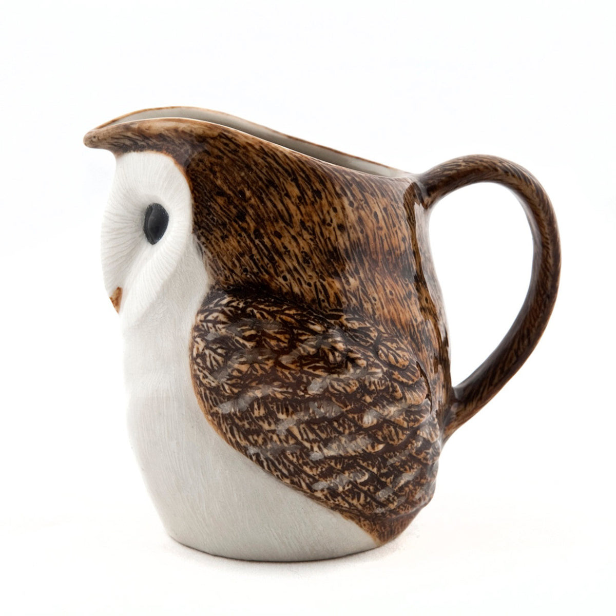 The QUAIL CERAMICS - BARN OWL JUG by QUAIL DESIGNS is a handpainted stoneware mug with brown and white detail, large black eyes, feather texture, a back handle, and is dishwasher safe. Shown against a white background.