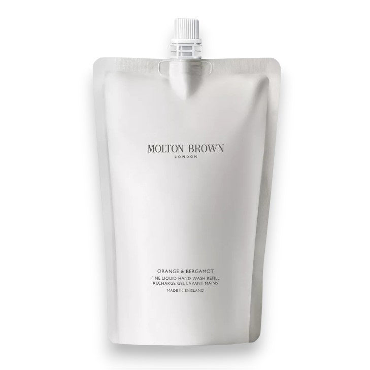 A silver refill pouch with a white cap, featuring "MOLTON BROWN" branding and labeled "Orange and Bergamot Body Wash Refill," infused with vibrant citrus notes.